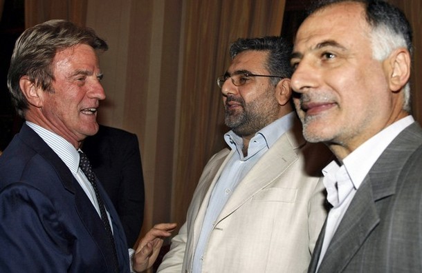 French Foriegn Minister Bernard Kouchner shakes hands with Hezbollah official Nawaf al-Musawi (C) as resigned Hezbollah Minister Mohammed Fniesh stands by (R),