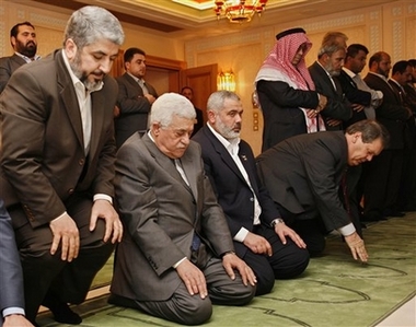 Fatah and Hamas leaders praying  together to Allah to help them to destroy Israel.  This picture is taken when the US money was