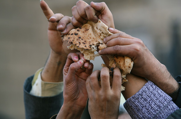 hands and bread Breaking of bread and sharing has always been a fruit of true Christianity