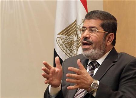 Mohamed Mursi, head of Muslim Brotherhood's political party, and Brotherhood's new presidential candidate, talks during interview with Reuters in Cairo