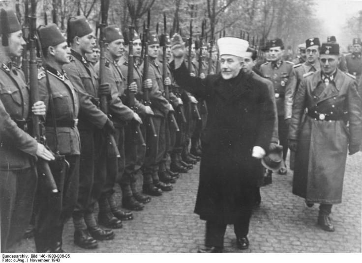The Grand Mufti Haj Amin al-Husseini of Jeruslaem saluting Muslims in Croatia who have become Nazi-soldiers. 