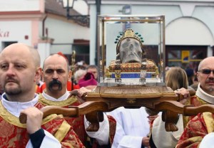 Roman Catholics carrying a skull on their shoulders.