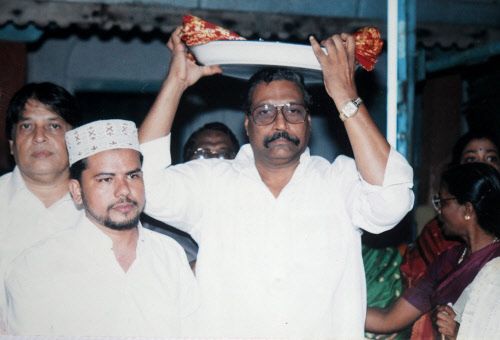 A Muslim is visiting a Hindu temple in India to participate in service and prayers. 