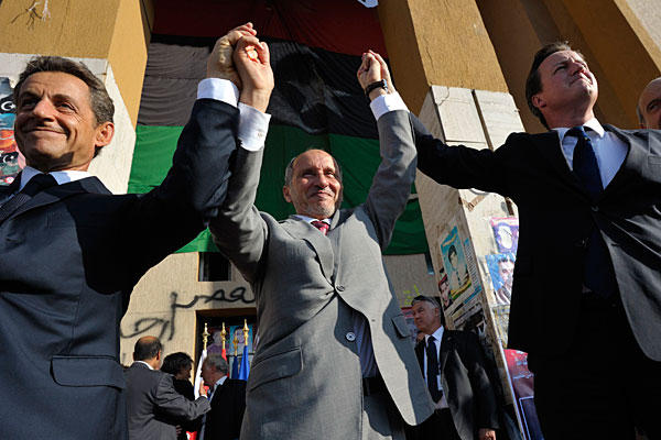 Nicolas Sarkhozy and Mustafa Abdul Jalil join David Cameron in Tripoly, rejoicing with everyone who shouts "allah U Akbar".