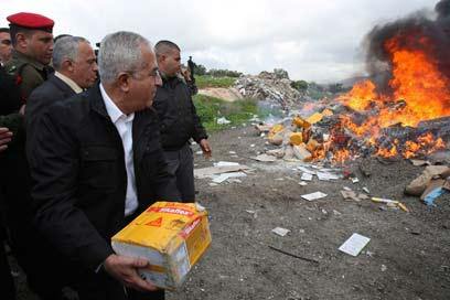 The Prime Minister of PLO burn Jewish products in Samaria. 