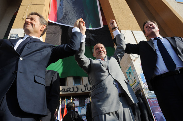 French President Nicolas Sarkozy, leader of Libya's interim government Mustafa Abdul-Jalil and Prime Minister David Cameron celebrate victory for "allah".