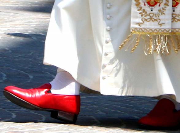 The last Pope walked in female garments and his shining read shoes. 