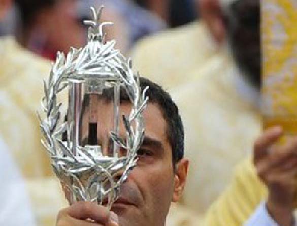 The wafer-Jesus has been replaced with the "holy blood" of the Pope, to be worshiped. 