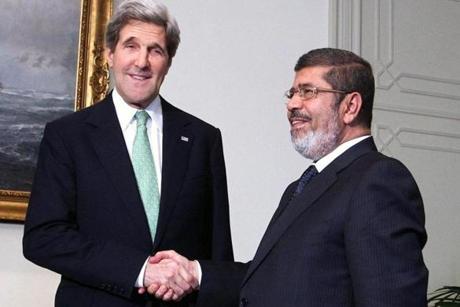 John Kerry and Muhamed Morsi in better days. Just after Moris was ellected President of Egypt. 