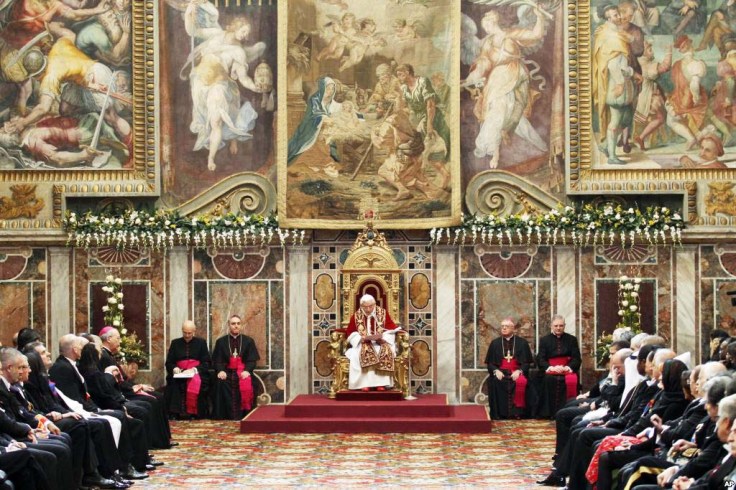 When the Pope greets the ambassadors, he sits elevated on his throne. 
