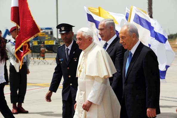 The Israeli authorities must skip the red carpet welcomes, and stop paying the bills for the papacy. 