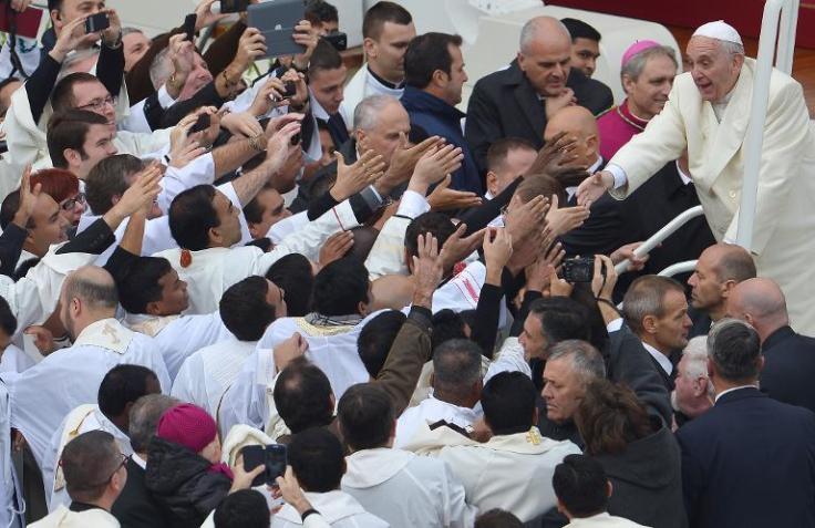 Religious people struggles to get a touch of their antichrist. 