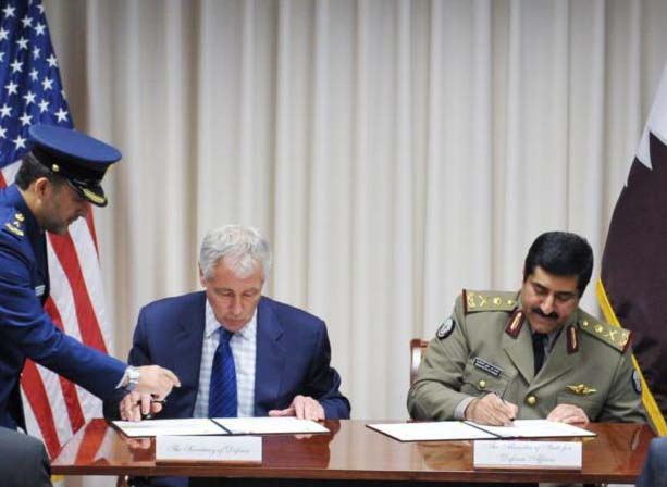 Chuck Hagel and Qatar's Defence Minister, Hamad bin Ali al-Attiyah.