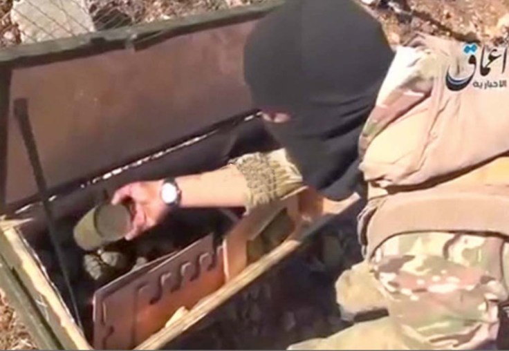 And ISIL terrorists looks through some weapons dropped inside Syria by US aircrafts. 