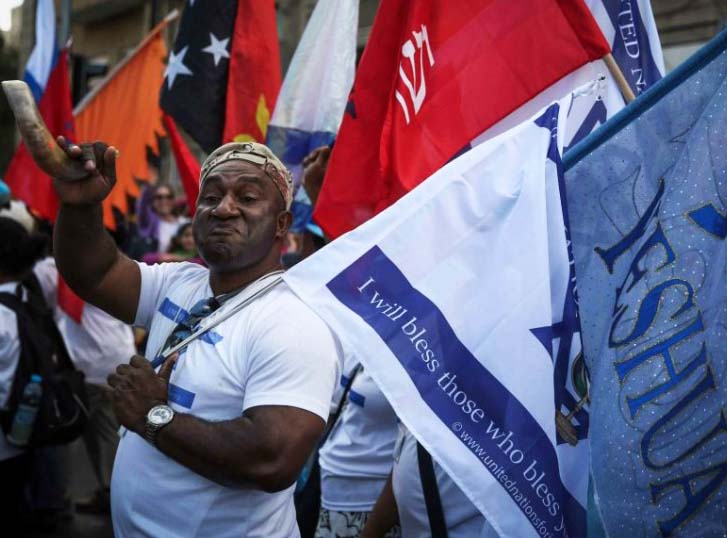 A believer in Yeshua walks in support of Israel during the Jerusalem march that us arranged every October. 