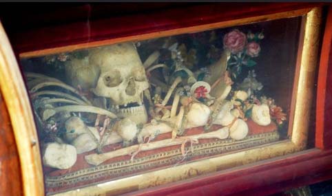 The skull is normally kept for disply in a box under the altar. 