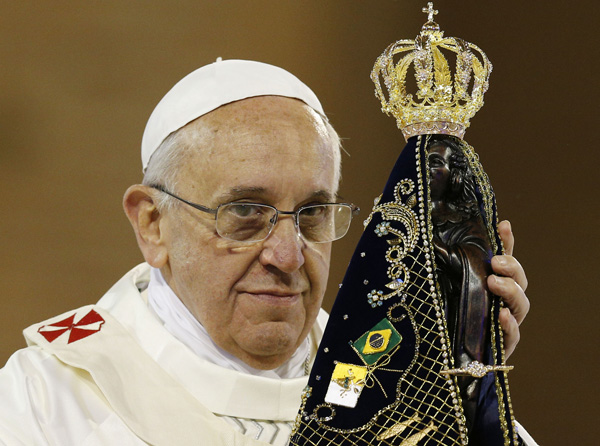 Pope Francis hold statue of Mary during Mass at Basilica of the National Shrine of Our Lady of Aparecida