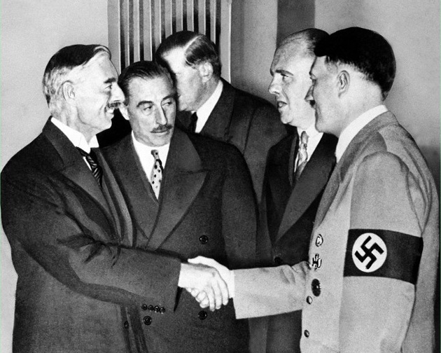 Neville Chamberlaine makes Hitler a "peace partner" in Munich in 1938. 