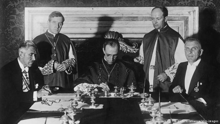 Hitler's Pope Pius XII signs the deal that securered the Vaticans right inside Nazi-Germany. 
