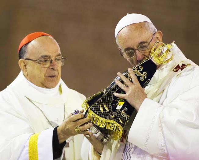 The Pope kisses the