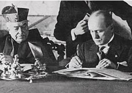 Cardinal Gasparri signs the deal with Benito Mussolini. 