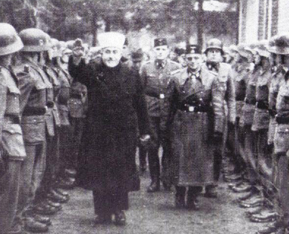 The Grand Mufti of Jerusaem greets a Nazi-battalion of strum troopers in Croatia in 1944. 
