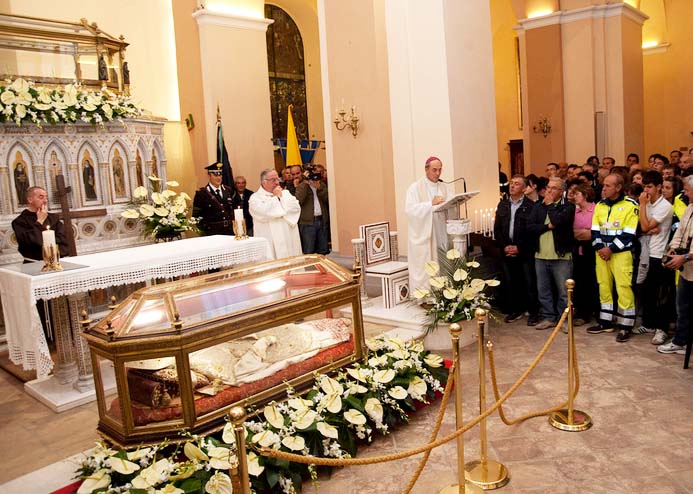 A mass is conducted to honor the exhumed corpse.