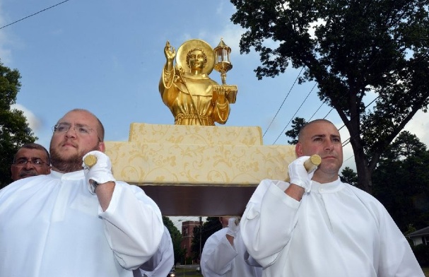 Another golden calf. Catholics carrying their idols of gold and a tooth on their shoulders. 