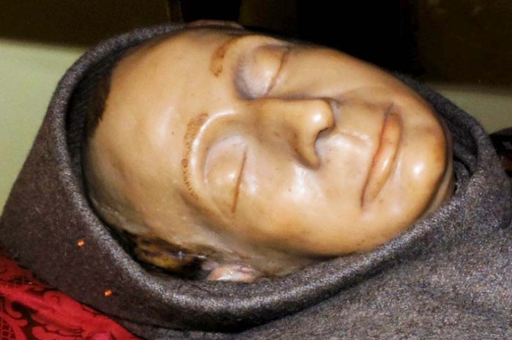 Behind this death mask, there is most likely an exhumed skull. 