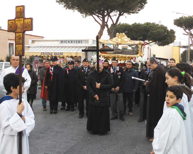 The flesh of a mortal man is paraded behind a cross in a town in central Italy. 