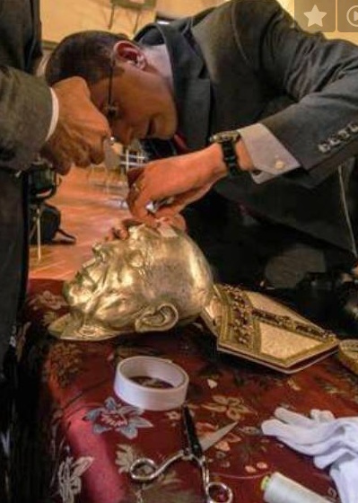 A new death mask is placed over the skull. 