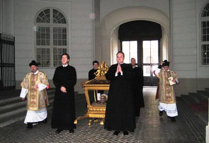 The Order brothers offer a prayer before they carry the skull. 