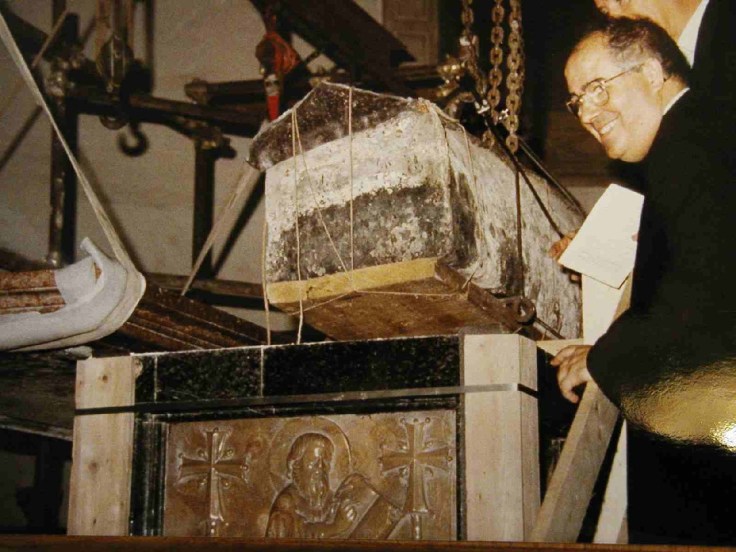 The coffin was taken out of the tomb, and skull and bones removed. 