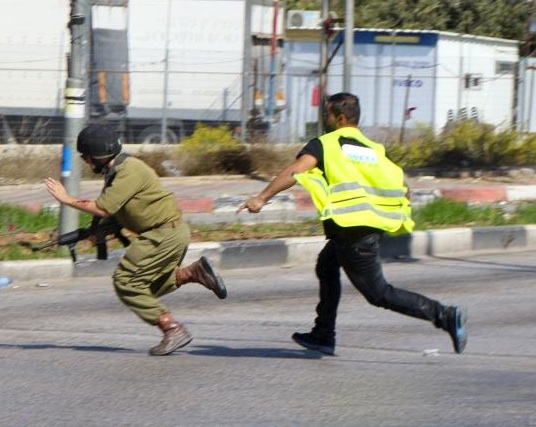 The military video-crew caught the Arab who attacked using a knife.