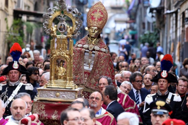 The head of Januarius and the container with his claimed blood of paraded through the street of Naples. 