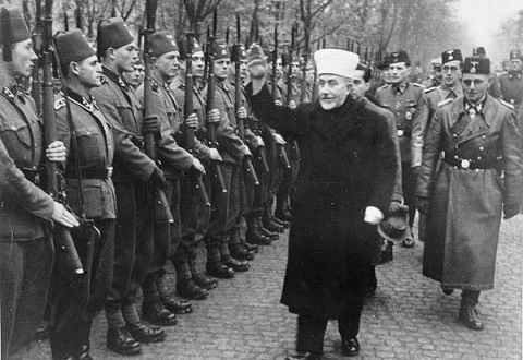 The Grand Mufti of Jerusalem and SS officers inspect a batalion of Muslim sturmtroopers in Croatia. 