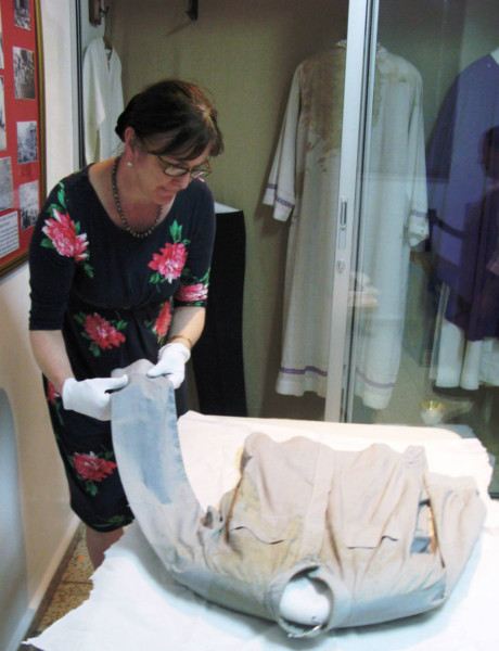 Stonyhursts curator Jan Graffius, preserving Monseñor Romeros shirt. (s)